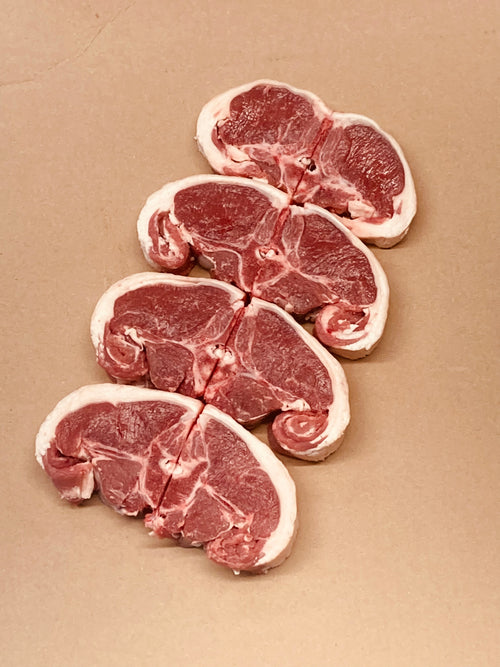 Raw meat slices on a beige background